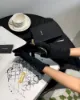 圖片 【YSL】粒面ㄇ字拉鍊對開短夾 黑金